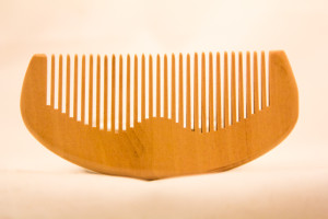 apply beard oil with a beard comb